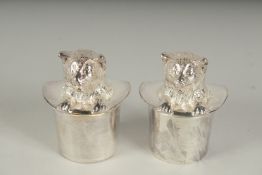 A PAIR OF SILVER PLATED SALT AND PEPPER POTS 