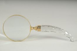 A MAGNIFYING GLASS with cut glass handle.