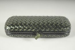 BOTTEGA VENETO. A BLACK AND GILT WOVEN CLUTCH BAG. 9.5ins long.
