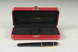 A CARTIER BALL POINT PEN in a Cartier case.
