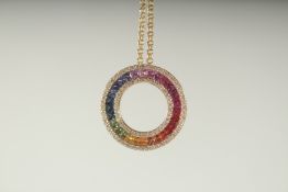 A SUPERB 18CT GOLD NATURAL SAPPHIRE AND DIAMOND CIRCLE OF LIFE PENDANT on a chain in a box.