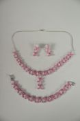 A GOOD SILVER RUBY & C Z NECKLACE, EARRINGS AND BRACELET.
