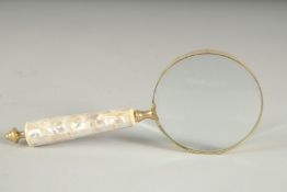 A MAGNIFYING GLASS with mother of pearl handle.