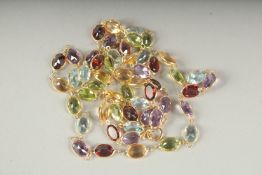 AN 18CT GOLD MULTI GEM MATCHING NECKLACE in a box.