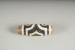A GOLD INLAID DZI BEAD