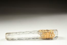 A GOOD FACETED AND GOLD MOUNTED LONG SCENT BOTTLE. 10cm long.