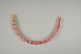A SILVER RUBY SET LINE BRACELET.