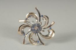 AN 18CT WHITE GOLD, DIAMOND AND SAPPHIRE CENTRAL BROOCH.