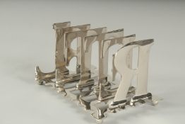 A SILVER PLATED LETTER TOAST RACK.