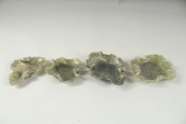 A SET OF FOUR LEAF SHAPED JADE DISHES.