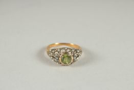 A 9CT GOLD PERIDOT AND PEARL RING.