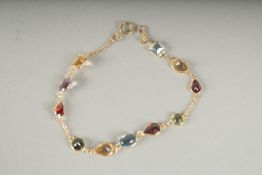 AN 18CT GOLD MULTI COLOURED STONE, BRACELET in a box.