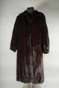 A LADIES FULL LENGTH MINK FUR COAT. CHARLES MOSS FURS. Cost £6000 new.