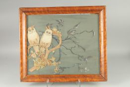 A framed needlework picture of two owls, 16