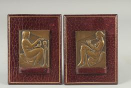A PAIR OF ART NOUVEAU CAST BRONZE RELIEFS on leather strut frames. 2.75ins x 2.25ins.