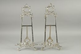 A PAIR OF SILVER PLATED PICTURE EASLES. 20ins high.