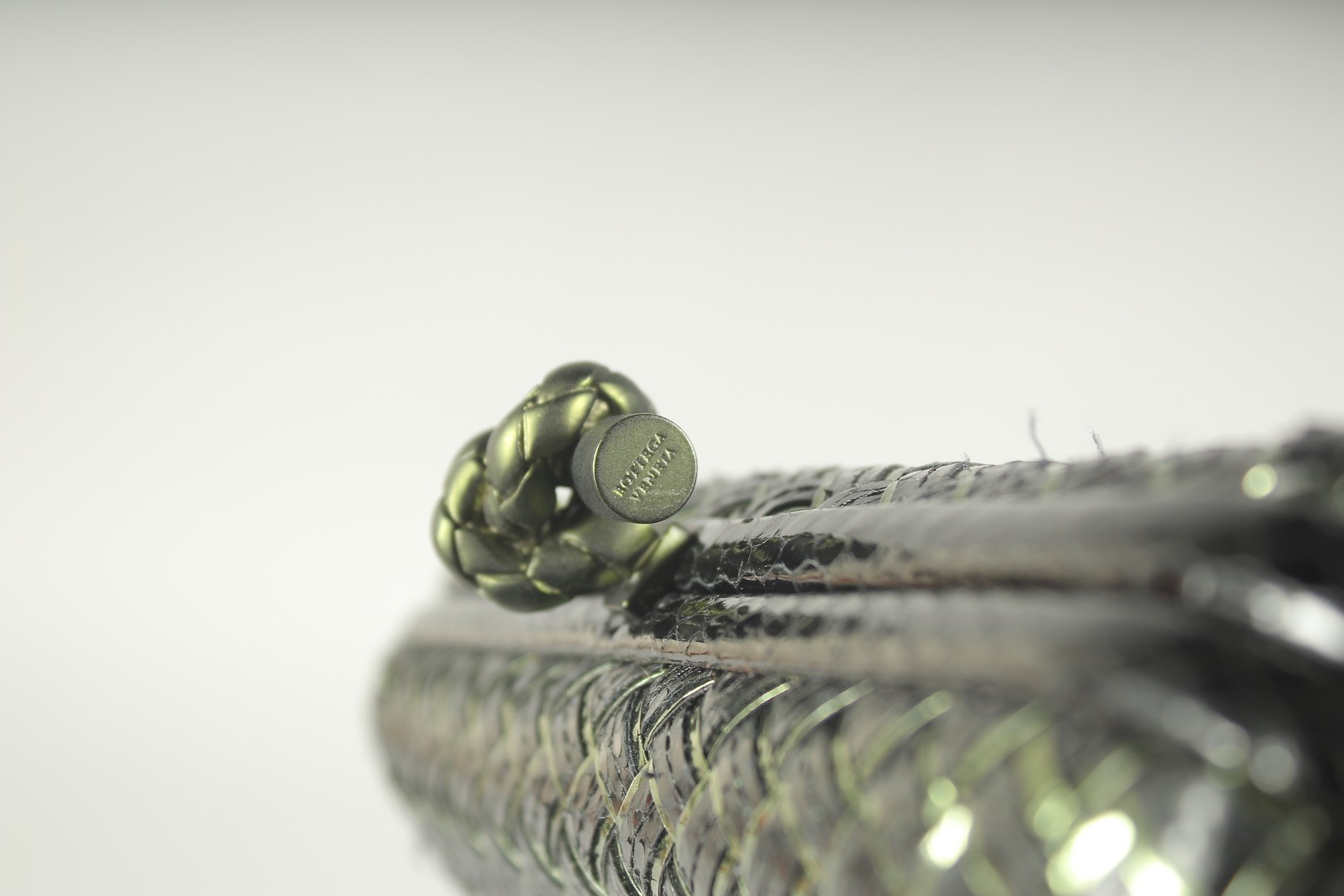 BOTTEGA VENETO. A BLACK AND GILT WOVEN CLUTCH BAG. 9.5ins long. - Image 4 of 5