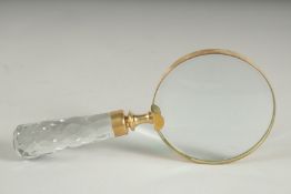 A MAGNIFYING GLASS with cut glass handle.