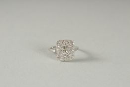 A PLATINUM DECO STYLE DIAMOND CLUSTER RING.