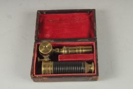 A GOOD SMALL 19TH CENTURY BRASS FOLDING TELESCOPE, 11ins extended, by Edward Davis, Leeds In a