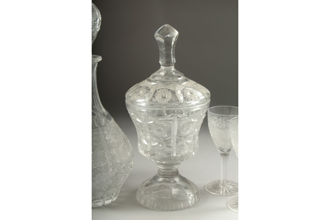 A GOOD CUT GLASS SHERRY DECANTER AND STOPPER, SIX GLASSES AND BOWL AND COVER.(8). - Image 4 of 5