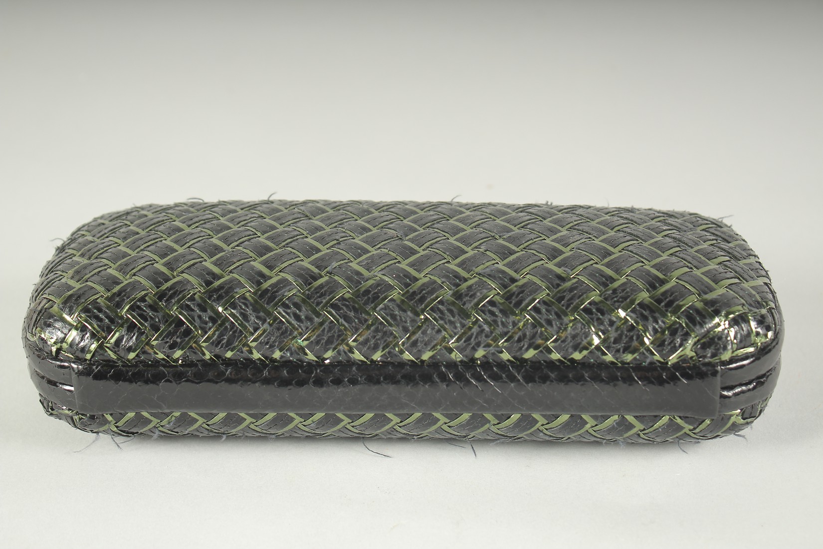 BOTTEGA VENETO. A BLACK AND GILT WOVEN CLUTCH BAG. 9.5ins long. - Image 2 of 5