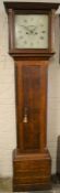 Georgian long case clock by Bothamly of Boston with an 8 day movement in an oak case with a