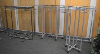 *6 glass topped clothes rails (4 on casters)