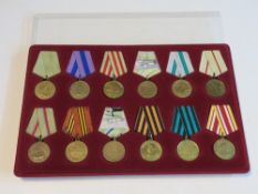 Twelve Soviet medals and ribbons, inc the Medal of Liberation of Prague,