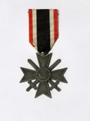 A WWII German War Merit Cross, second class, with cross swords, with original ribbon.