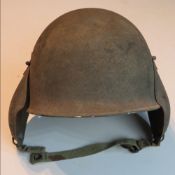 A WWII US M3 Bomber Crew helmet with liner and instructions.
