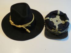 Two US re-enactors Civil War themed hats, one being Officers Kepi, the other a US Cavalry hat,