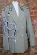 An East German Captains Border Troop Grenztruppen DDR Tunic and trousers with the NVA medal.