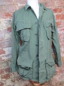 A US Army olive green tropical jacket, size XSMALL/ REG.