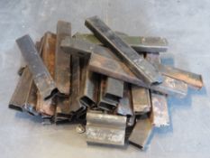 Twenty-four Sten magazines together with a Soviet medal and SS badge.