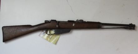 A deactivated Carcano M91/38 6.5mm carbine. Brescia manufacture, and dated 1901.