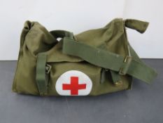 A Military First Aid kit with first aid accessories including tourniquet, airway pipe, bandages,