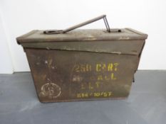 An US ammo tin with original stencilling, a quantity of wooden stocks, etc.