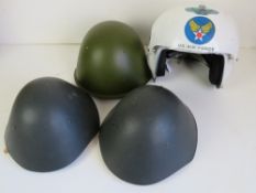 Four assorted helmets, being 25th fighter squadron pilots helmet,