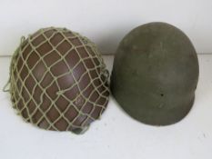 A Japanese type 90 helmet with a Belgium M1 Helmet liner.