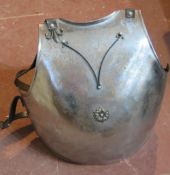 Decorative armour plate with straps.