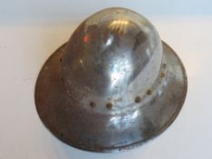 A decorative reproduction civil war style steel helmet.