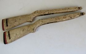 Two WWII M1 Carbine stocks (white painted), both with butt plates.