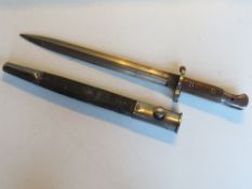 A bayonet with scabbard marked Sanderson Sheffield to the blade.