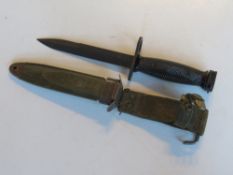 A US M8A1 bayonet in sheath