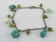 A 925 silver bracelet set with turquoise agate and glass beads.