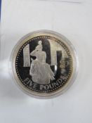 The Royal Mint Queens 80th Birthday silver Proof coin in protective pod with certificate.