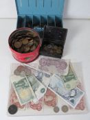 A quantity of assorted coinage and bank notes including cash boxes,