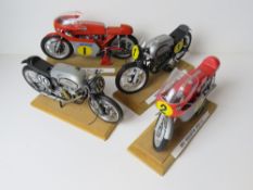 A set of four scale model vintage motorbikes inc MV Augusta 350 and 500cc and two Nortons.