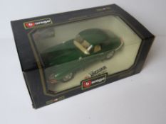 A Burago Jaguar E Coupe (1961), diecast metal, 1/18 scale, in original packaging.
